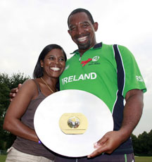 Delighted Ireland coach Phil Simmons with his wife Jayce after his team won the WCL Division One trophy.