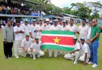The Surinam squad celebrate after their victory over Turks and Caicos