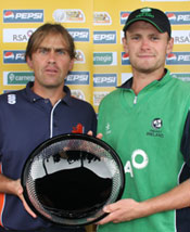 Netherlands captain Jeroen Smits and Ireland captain William Porterfield share the trophy after the final was washed out.